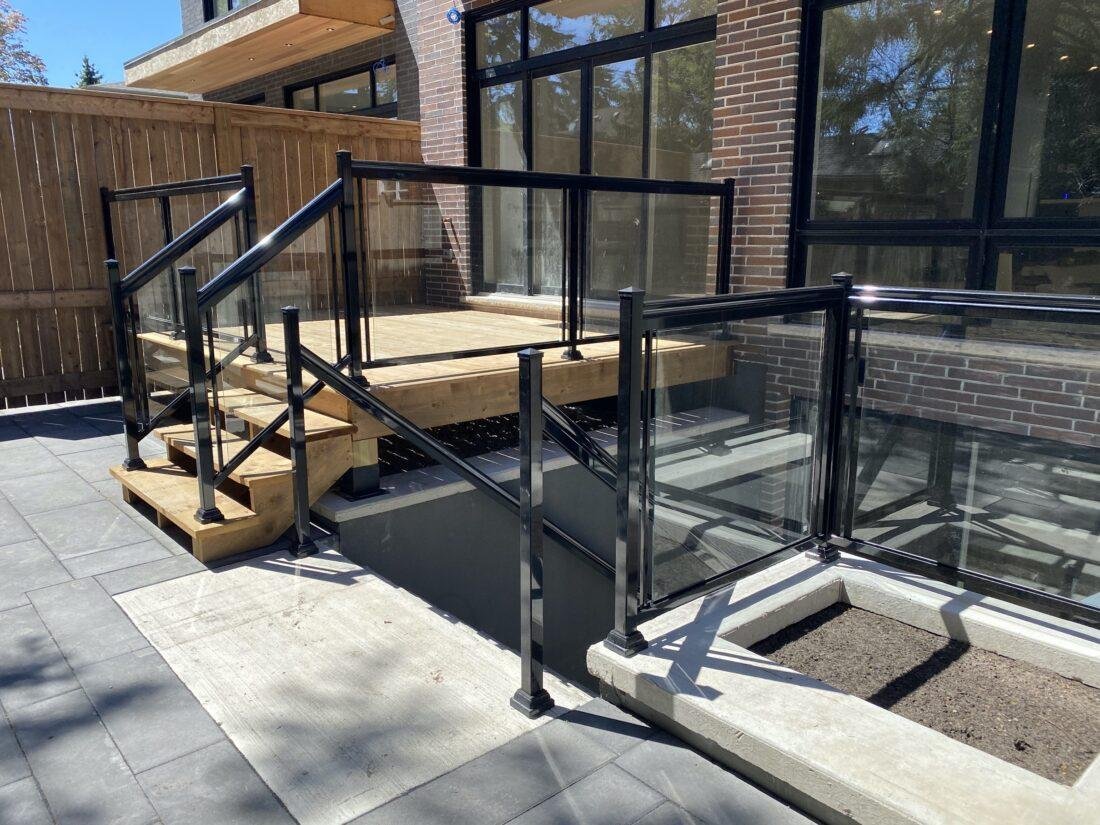 patio railing with aluminum and glass on a rear deck and walk out in toronto