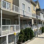 white aluminum railing on stacked town houses