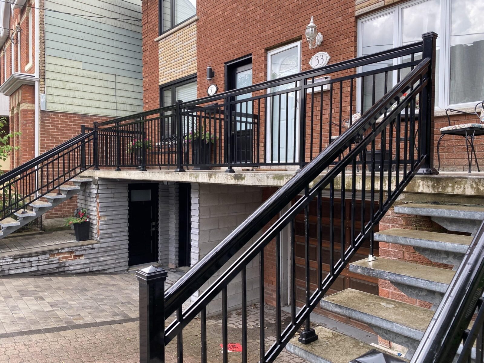 black aluminum railing on semi-detached house