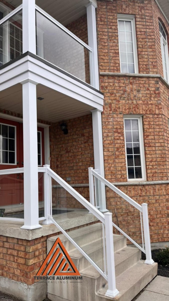 2 storeys of white aluminum railing and white aluminum columns